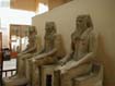 Three Sitting Statues